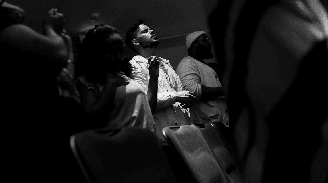 Worshipper in deep reverence during service